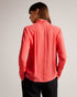 JULINAA-Tops-JULINAA is a lightweight, feminine layer that transitions easily from day to evening. This lightweight blouse pairs wonderfully with wide-leg trousers and heels for a polished office look—or switch it up for jeans and sandals on a sunny weekend getaway. Blouse Neck tie Looped rouleaux trim Long sleeved Button fastening Lightweight fabric Julia is 5'10" / 1.78m and wears Coral in a Ted size 1- Ted Baker Romania